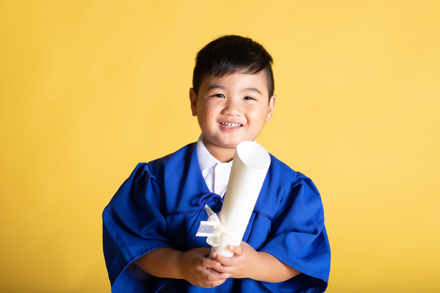 Kid in Toga with Diploma